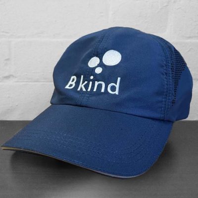 A blue hat with the word " bkind " on it.