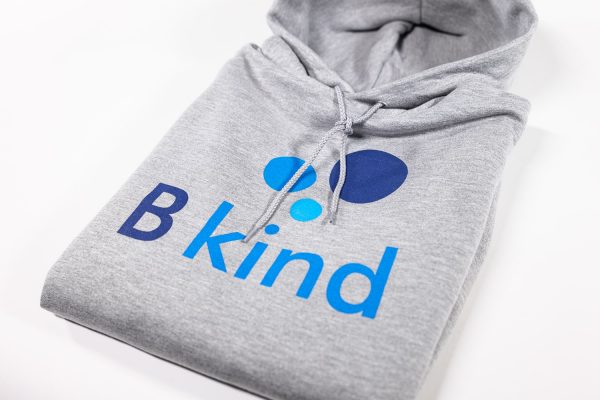 A close up of the b kind logo on a hoodie