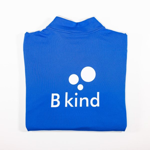 A blue shirt with the word " b kind " on it.