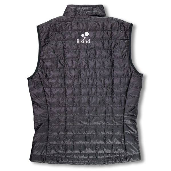 A black vest with a logo on the back.