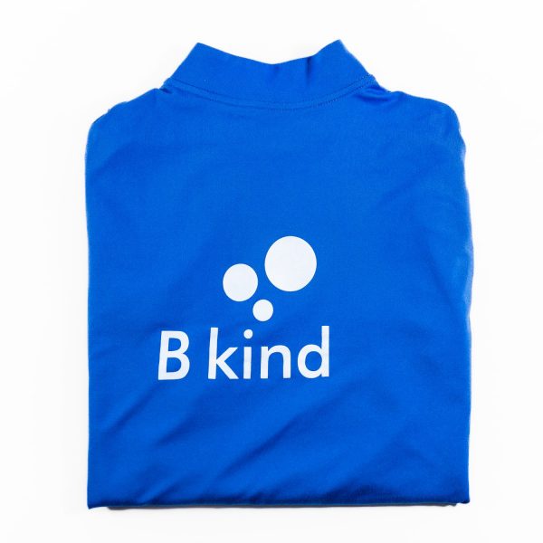 A blue shirt with the word " b kind " on it.