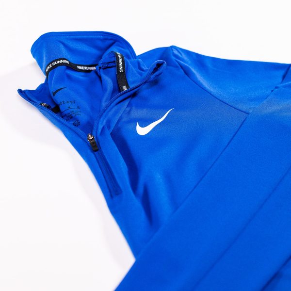 A blue nike jacket with white swoosh on it.