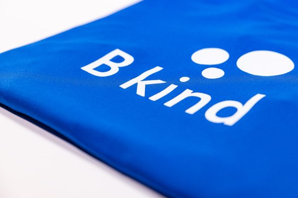 A close up of the logo on a blue shirt