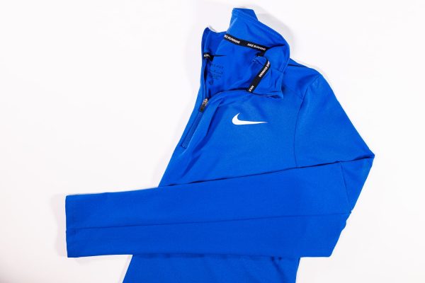 A blue nike jacket with an open hood.