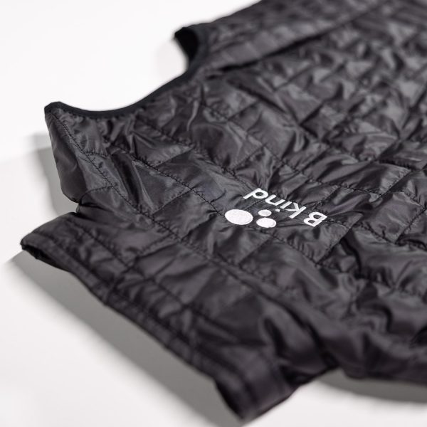 A close up of the puffer vest logo on it.